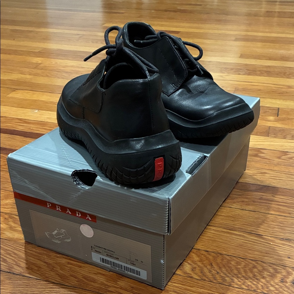 Prada women’s  Black Leather Sneakers